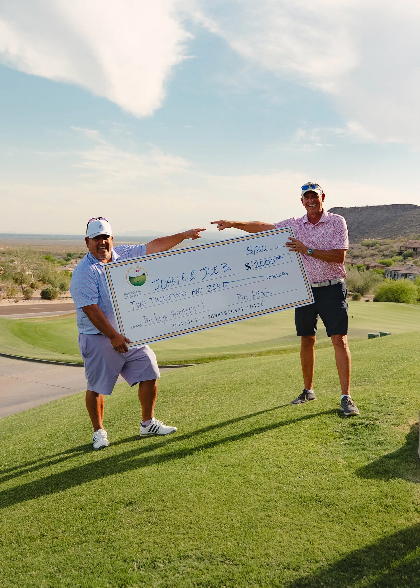 Pin High winners with their prize check
